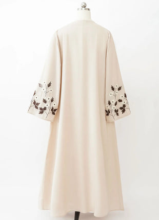 Apricot Color Muslim Abaya Boasting Exquisite Floral Cuff Embroidery Blending Timeless Elegance and Fashion for Ramadan Islamic