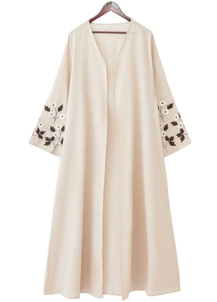 Apricot Color Muslim Abaya Boasting Exquisite Floral Cuff Embroidery Blending Timeless Elegance and Fashion for Ramadan Islamic