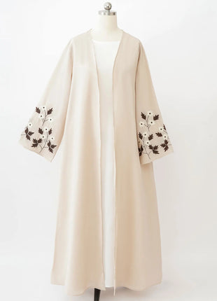 Apricot Color Muslim Abaya Boasting Exquisite Floral Cuff Embroidery Blending Timeless Elegance and Fashion for Ramadan Islamic